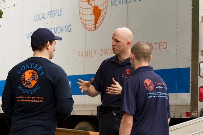 Foster's Moving & Storage crew at the truck before an inter-provincial move
