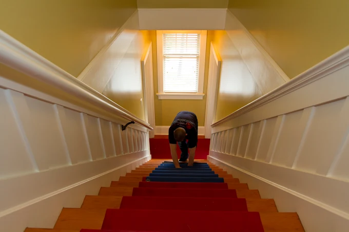 Foster's crew laying floor runners to protect a home during a move